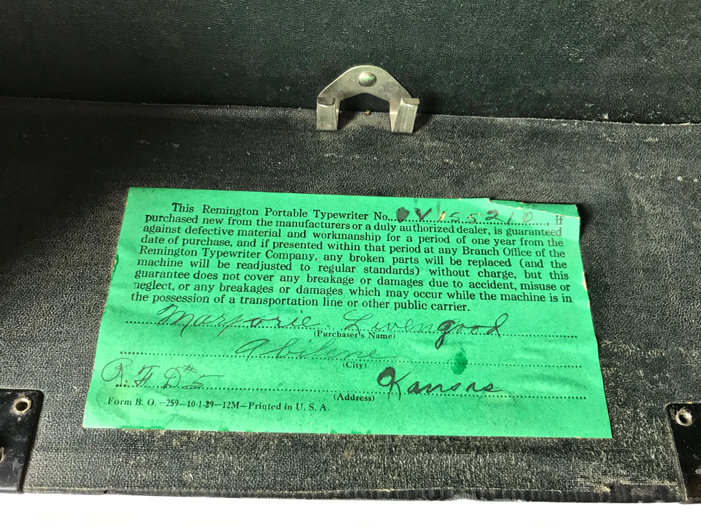 This original label inside the typewriter case explains the one-year Remington guarantee under which any broken parts will be replaced and readjusted to regular standards.